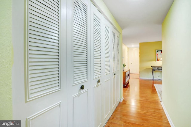 hallway with light wood-type flooring