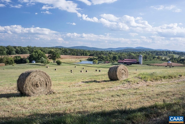 view of mountain feature featuring a rural view and a water view