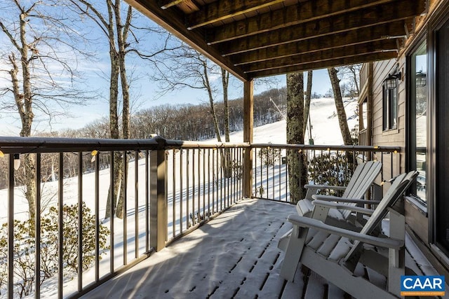 view of snow covered deck