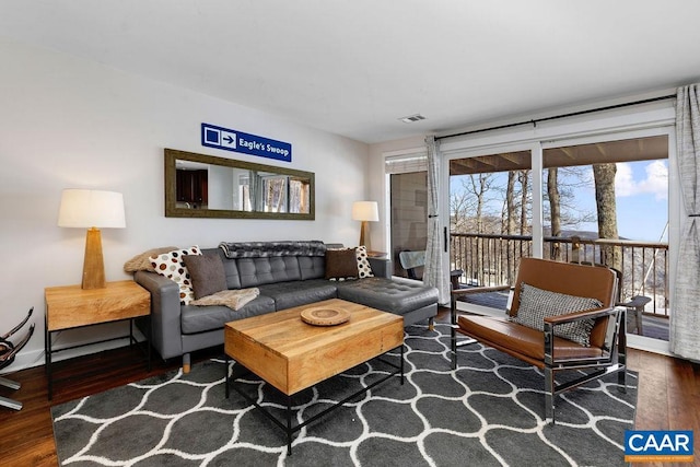 living room with dark wood-type flooring