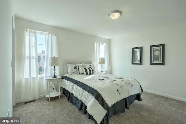 bedroom with light carpet