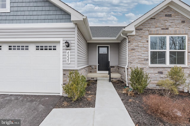 doorway to property featuring a garage