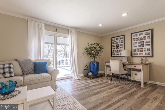 home office with ornamental molding and hardwood / wood-style floors