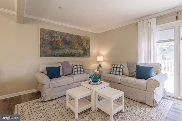 living room with ornamental molding and wood-type flooring