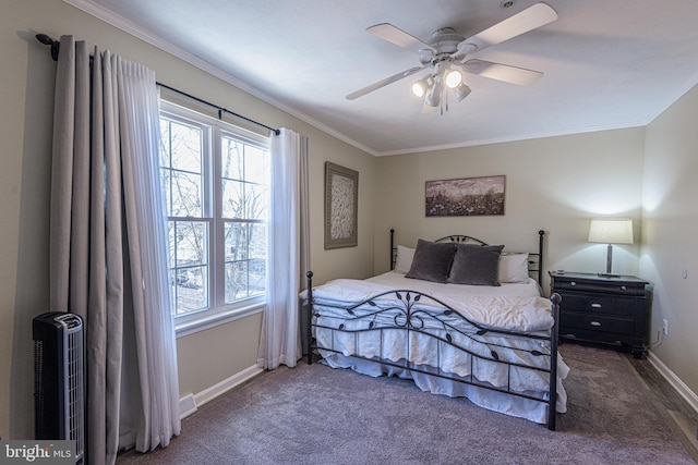 bedroom with ceiling fan, ornamental molding, and dark colored carpet