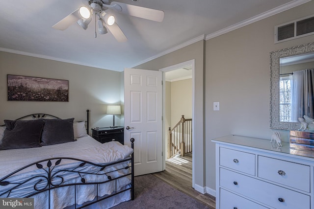 bedroom with wood-type flooring, ornamental molding, and ceiling fan