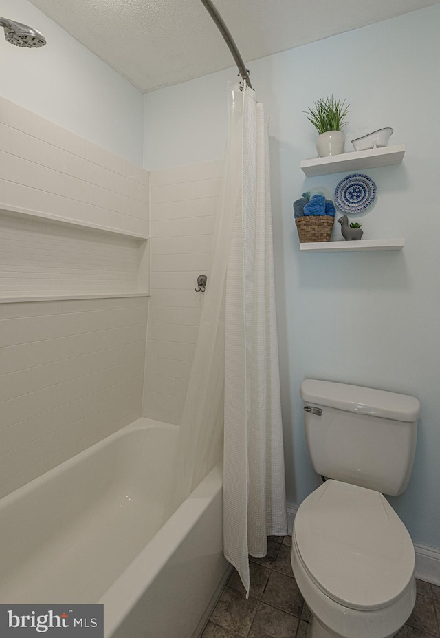 bathroom with shower / tub combo with curtain, a textured ceiling, and toilet