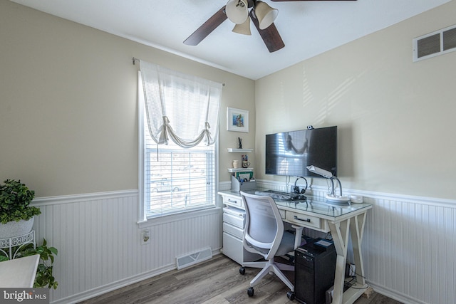 office area with ceiling fan and light hardwood / wood-style flooring