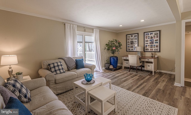 living room featuring crown molding and hardwood / wood-style floors