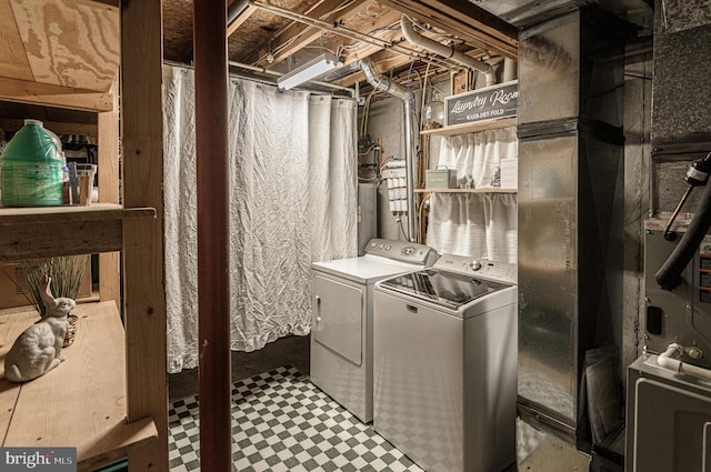 laundry area with separate washer and dryer