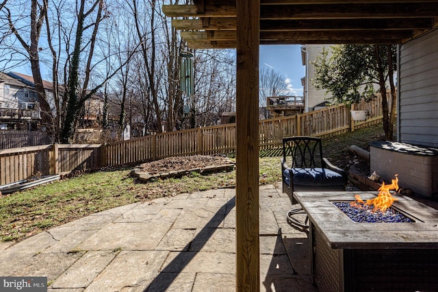 view of patio with a fire pit