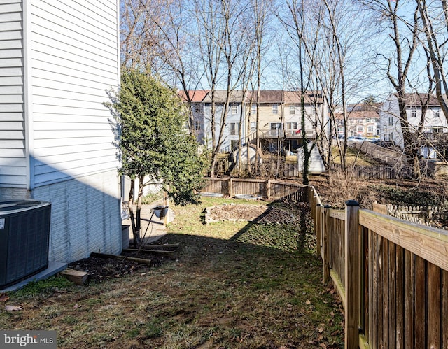 view of yard featuring central air condition unit