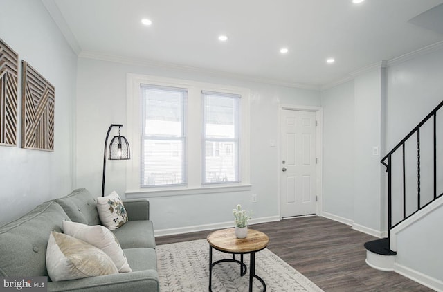 living room featuring a wealth of natural light, crown molding, and dark hardwood / wood-style floors