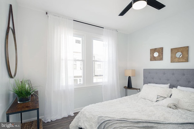 bedroom featuring ceiling fan and dark wood-type flooring