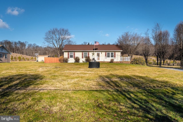 back of house featuring a yard