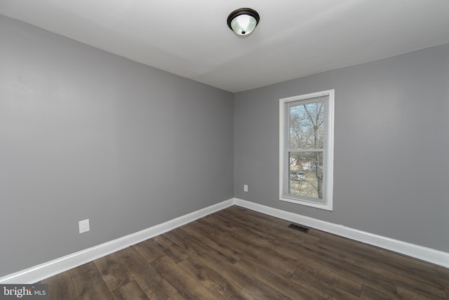 empty room featuring dark hardwood / wood-style floors