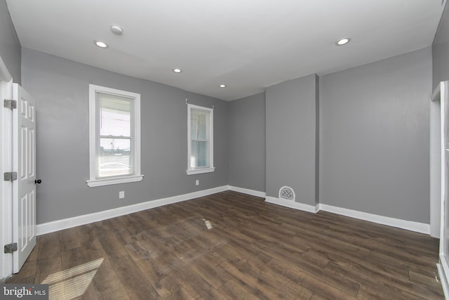 empty room featuring dark wood-type flooring