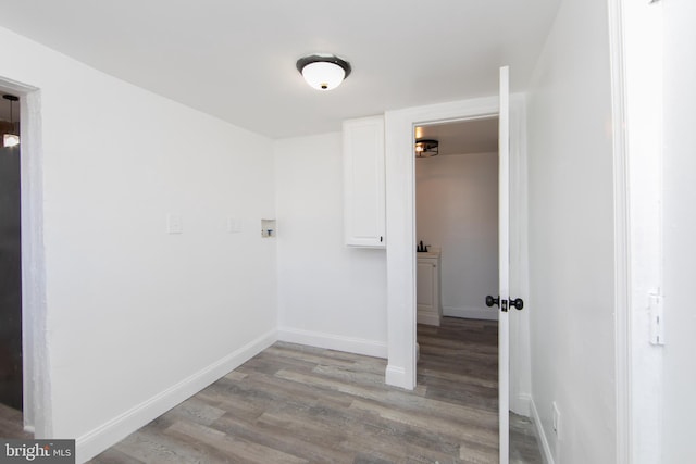 laundry room with light hardwood / wood-style floors