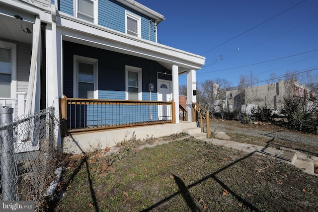 view of property exterior featuring covered porch