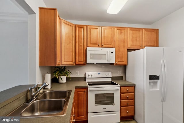 kitchen featuring sink and white appliances