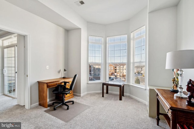 home office featuring light colored carpet