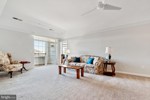 living room featuring ceiling fan and carpet