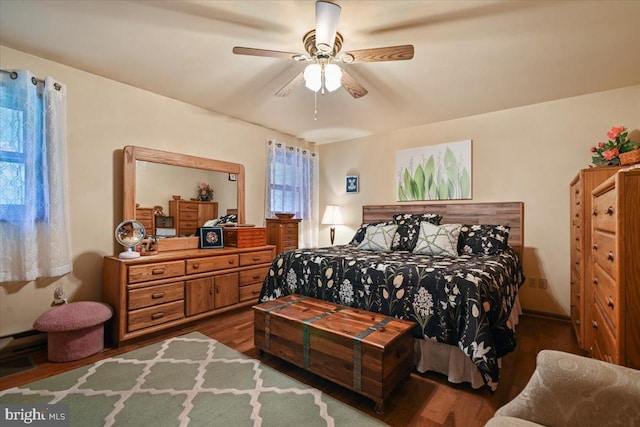 bedroom with hardwood / wood-style floors and ceiling fan