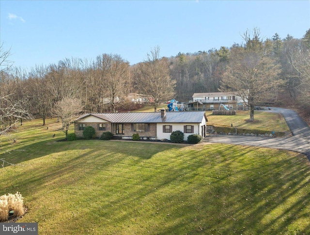 view of front facade with a front yard and a porch