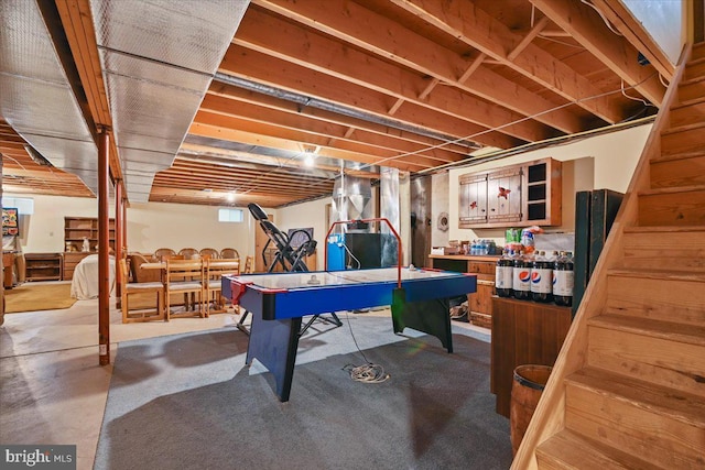 recreation room with concrete flooring