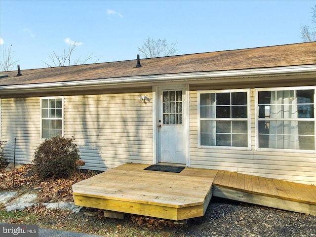 entrance to property with a deck