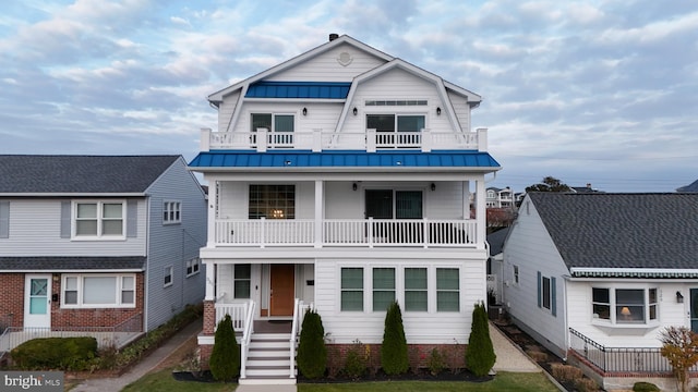 view of front of property with a balcony