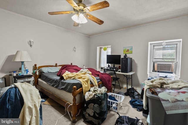 bedroom with ceiling fan, light colored carpet, cooling unit, and a textured ceiling