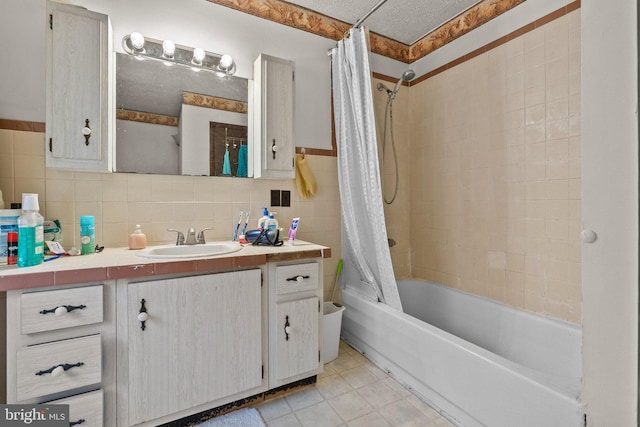 bathroom with tile walls, backsplash, vanity, and shower / bath combo