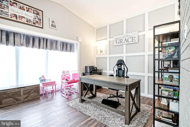 office space with lofted ceiling and hardwood / wood-style flooring