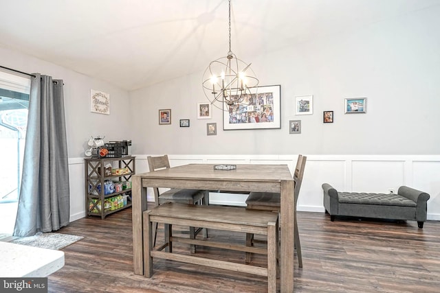 dining area featuring dark hardwood / wood-style flooring and a chandelier