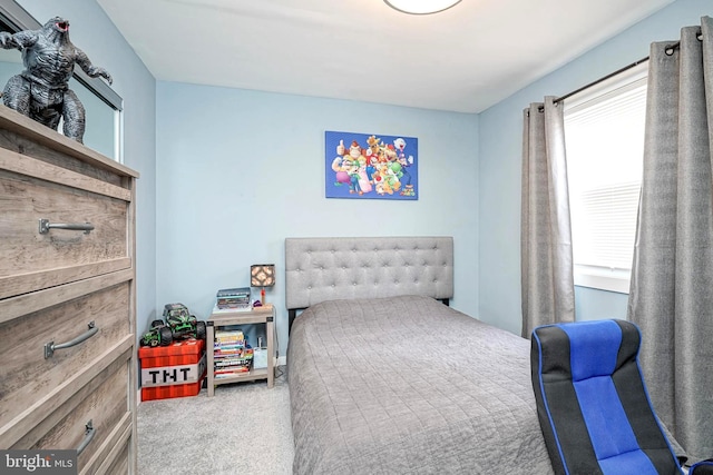 carpeted bedroom featuring multiple windows