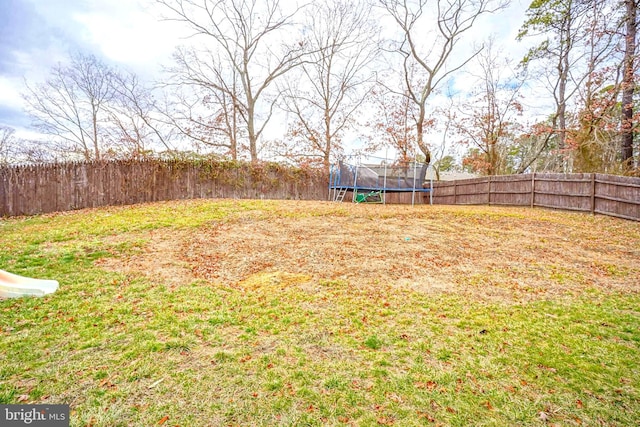 view of yard featuring a trampoline