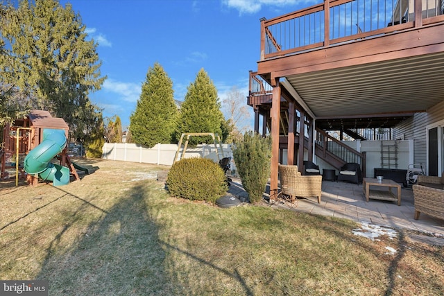 view of yard with a patio area, a deck, a playground, and outdoor lounge area