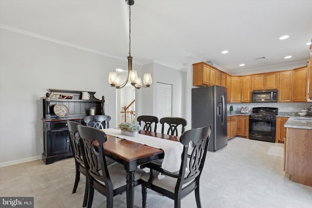 dining area with sink, crown molding, and a chandelier