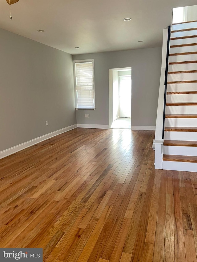 unfurnished living room featuring light hardwood / wood-style flooring