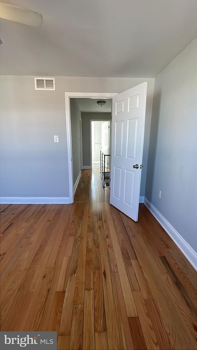 spare room with hardwood / wood-style flooring