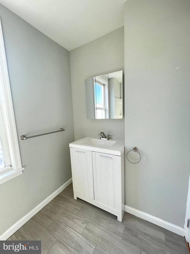 bathroom featuring vanity and wood-type flooring