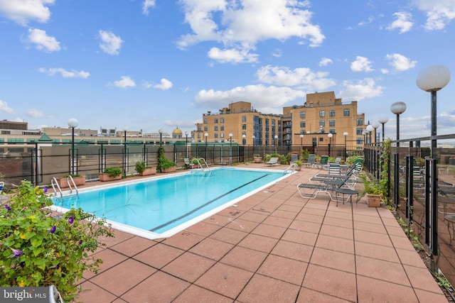 view of pool featuring a patio area