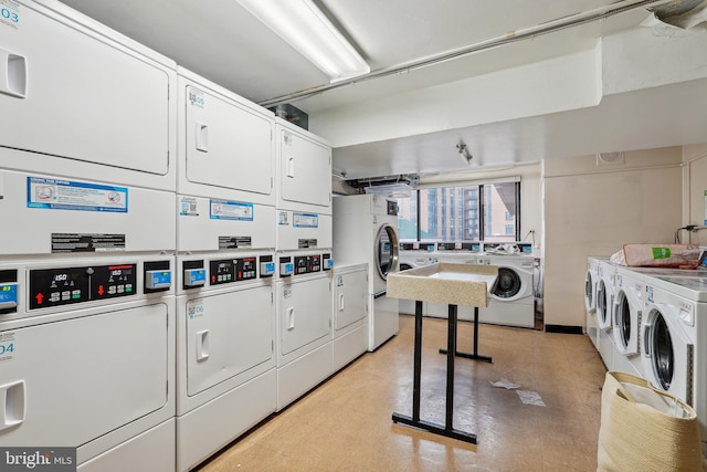 laundry area with separate washer and dryer and stacked washer / dryer