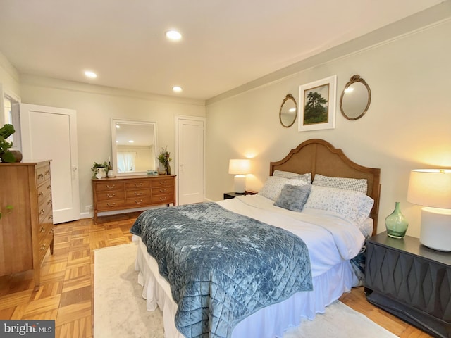 bedroom with light parquet floors and ornamental molding