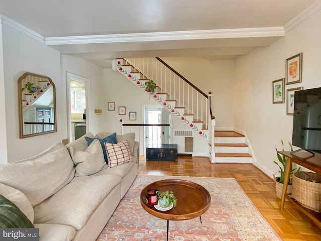 living room with ornamental molding, parquet flooring, and radiator