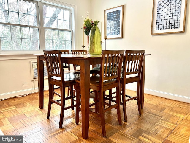 dining area featuring light parquet flooring