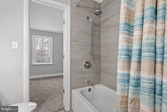 bathroom featuring toilet and shower / bathtub combination with curtain