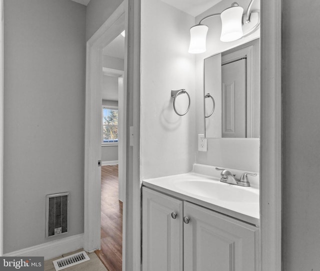 bathroom featuring vanity and wood-type flooring