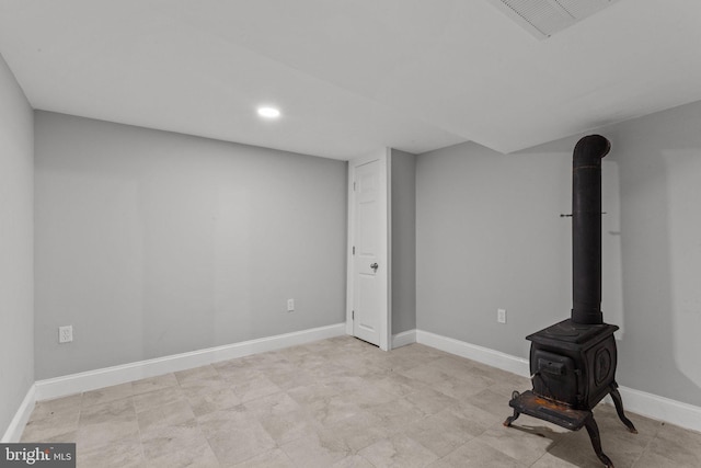 basement featuring a wood stove